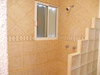Guest bathroom with tiled shower.