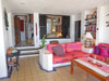 Louvered shutters open to the living room providing views of the bay from the master bedroom.