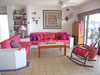 Yool Caanal #2's living room has a festive decor and glass doors open to the covered patio.