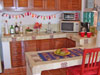 Small galley kitchen is well stocked and includes everything you need to prepare meals at home.