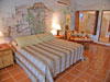 Bedroom has king bed and seating area.