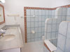 Large bathroom with double marble vanity.